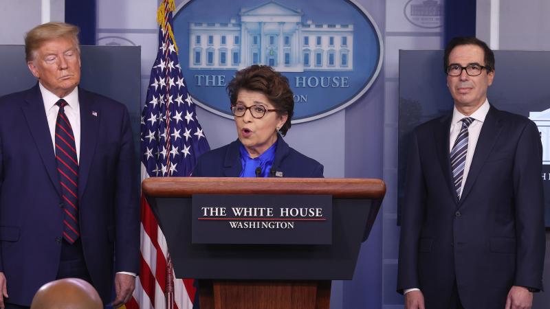 Small Business Administration chief Jovita Carranza speaks at the White House as President Trump and Treasury Secretary Steven Mnuchin look on. Some small business owners are facing delays in applying for a new loan program. Small Business Administration chief Jovita Carranza speaks at the White House as President Trump and Treasury Secretary Steven Mnuchin look on. Some small business owners are facing delays in applying for a new loan program.