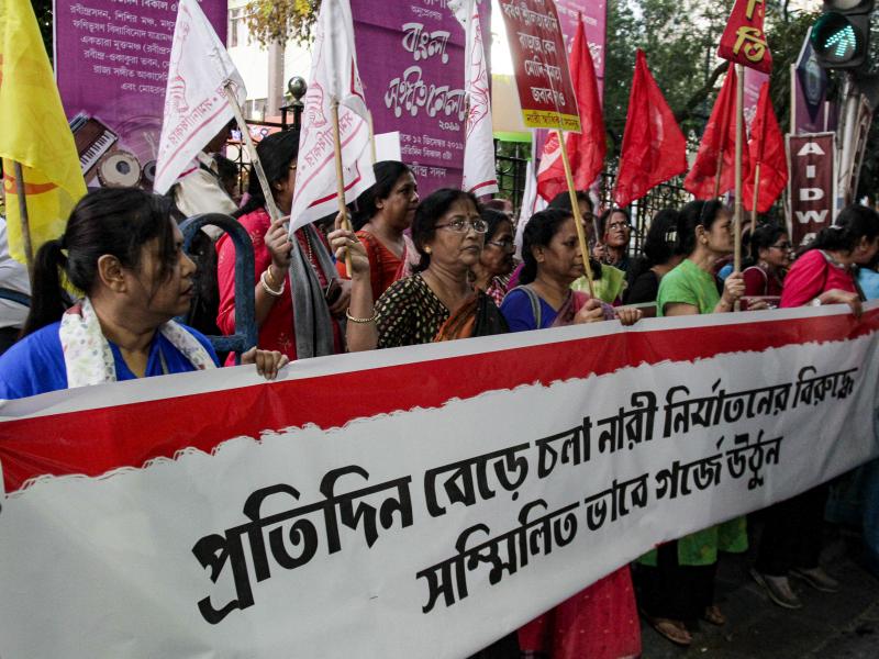 Activists demanding justice in the case of a veterinarian who was gang-raped and killed last week shout slogans during a protest on Thursday in Kolkata, India. Activists demanding justice in the case of a veterinarian who was gang-raped and killed last week shout slogans during a protest on Thursday in Kolkata, India.