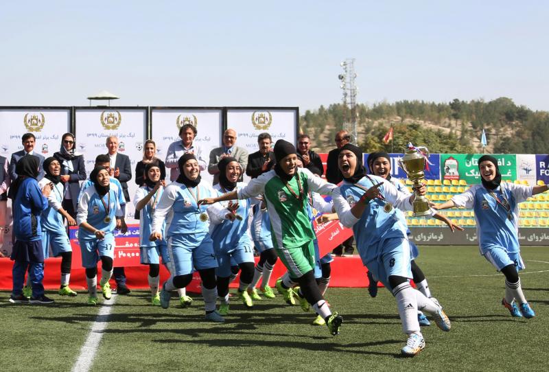 Players from the Herat Storm celebrate after winning the championship of the Afghan women's soccer league on October 16 in Kabul. Players from the Herat Storm celebrate after winning the championship of the Afghan women's soccer league on October 16 in Kabul.