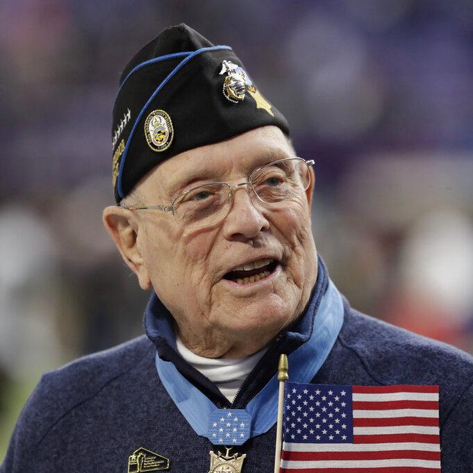 Woody Williams assists with the coin toss before Super Bowl 52 in February 2018 in Minneapolis. Williams, the last remaining Medal of Honor recipient from World War II, died Wednesday at 98, at the Veterans Affairs medical center bearing his name in Hunti Woody Williams assists with the coin toss before Super Bowl 52 in February 2018 in Minneapolis. Williams, the last remaining Medal of Honor recipient from World War II, died Wednesday at 98, at the Veterans Affairs medical center bearing his name in Hunti