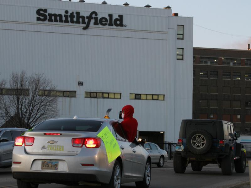 Employees and family members protest outside a Smithfield Foods processing plant in Sioux Falls, S.D., on April 9. Smithfield is being sued over its handling of the coronavirus pandemic. Employees and family members protest outside a Smithfield Foods processing plant in Sioux Falls, S.D., on April 9. Smithfield is being sued over its handling of the coronavirus pandemic.
