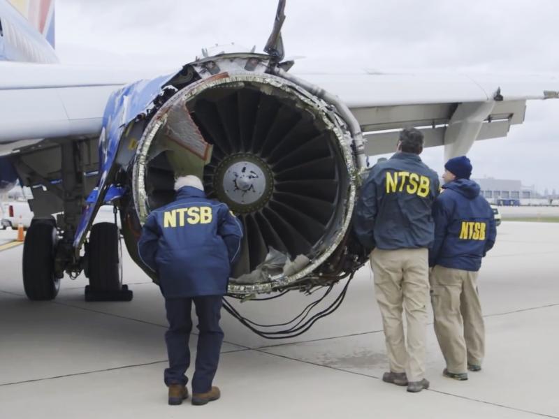 National Transportation Safety Board investigators examine damage to the engine of the Southwest Airlines plane that made an emergency landing at Philadelphia International Airport in Philadelphia in 2018. The NTSB was unable to begin several investigatio National Transportation Safety Board investigators examine damage to the engine of the Southwest Airlines plane that made an emergency landing at Philadelphia International Airport in Philadelphia in 2018. The NTSB was unable to begin several investigatio