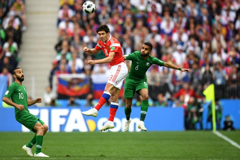 Yury Zhirkov of Russia wins a header Mohammed Alburayk of Saudi Arabia during the 2018 FIFA World Cup Russia Group A match between Russia and Saudi Arabia at Luzhniki Stadium on Thursday in Moscow, Russia. Yury Zhirkov of Russia wins a header Mohammed Alburayk of Saudi Arabia during the 2018 FIFA World Cup Russia Group A match between Russia and Saudi Arabia at Luzhniki Stadium on Thursday in Moscow, Russia.