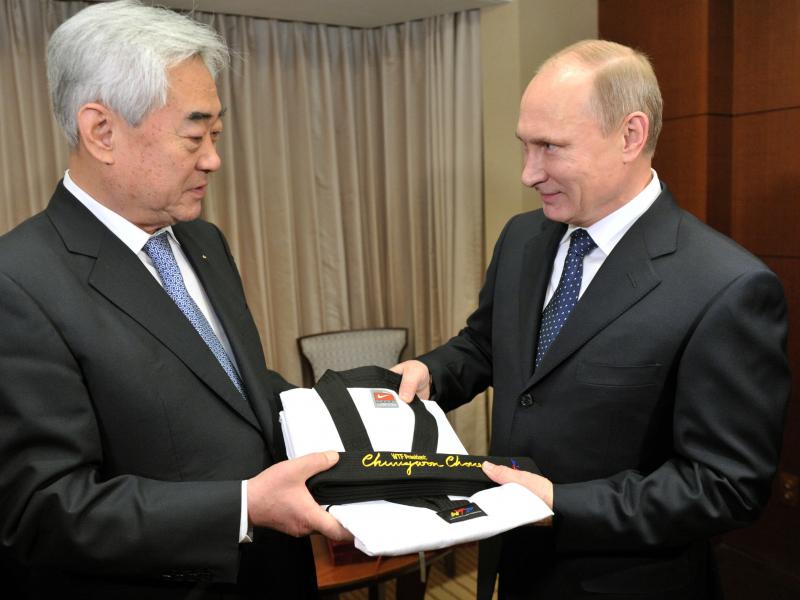 World Taekwondo Federation President Choue Chung-won, left, gives an honorary taekwondo black belt and uniform to Russian President Vladimir Putin in 2013. World Taekwondo Federation President Choue Chung-won, left, gives an honorary taekwondo black belt and uniform to Russian President Vladimir Putin in 2013.