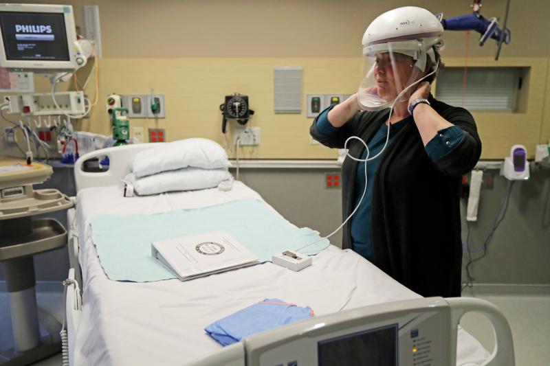 The first U.S. case of COVID-19 was treated at Providence Regional Medical Center in Everett, Washington. Robin Addison, a nurse there, demonstrates how she wears a respirator helmet with a face shield intended to prevent infection. The first U.S. case of COVID-19 was treated at Providence Regional Medical Center in Everett, Washington. Robin Addison, a nurse there, demonstrates how she wears a respirator helmet with a face shield intended to prevent infection.