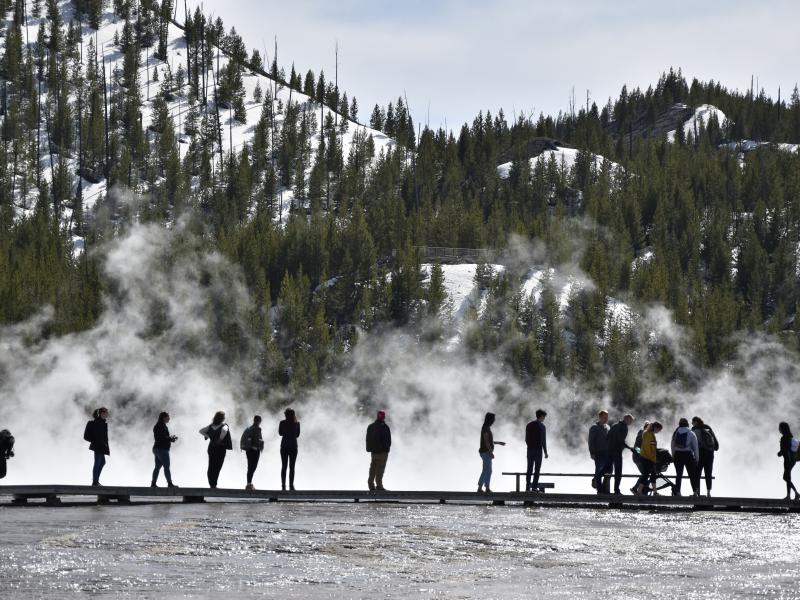 Visitors are seen at Grand Prismatic Spring in Yellowstone National Park, Wyo., last year. Visitors are seen at Grand Prismatic Spring in Yellowstone National Park, Wyo., last year.
