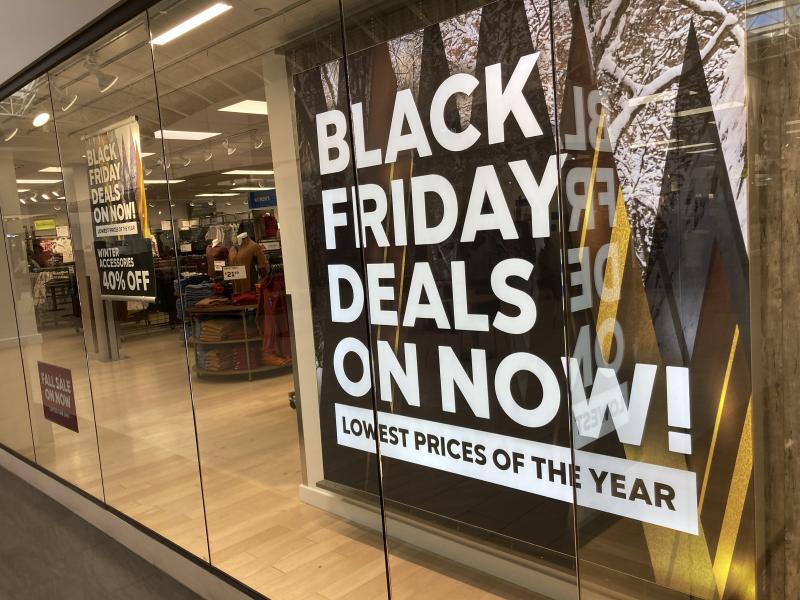 A sign promote sales at a clothing store in a Colorado mall. A sign promote sales at a clothing store in a Colorado mall.