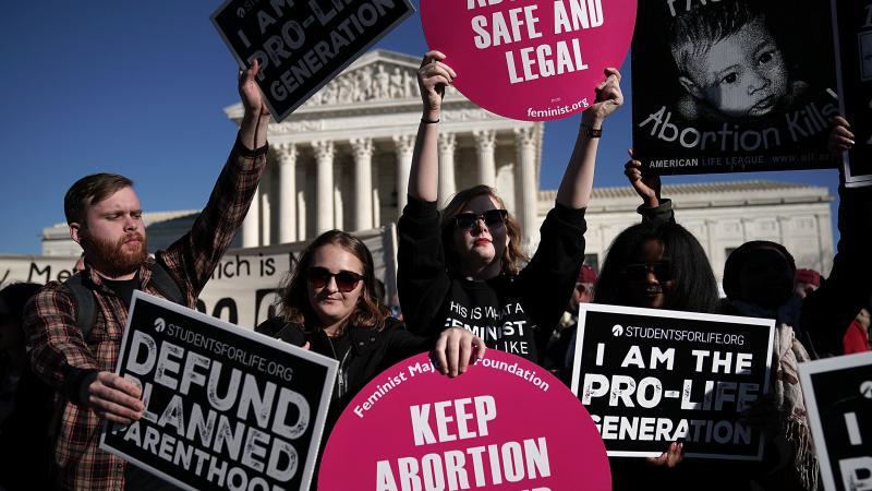 Activists both supporting and opposing abortion rights gathered in front of the the Supreme Court during the March for Life on Jan. 19. Activists both supporting and opposing abortion rights gathered in front of the the Supreme Court during the March for Life on Jan. 19.