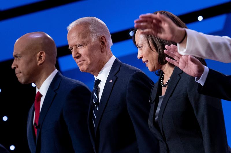 Democratic presidential hopefuls (from left): Sen. Cory Booker, D-N.J., former Vice President Joe Biden, and Sen. Kamala Harris, D-Calif., onstage before the July debate. Democratic presidential hopefuls (from left): Sen. Cory Booker, D-N.J., former Vice President Joe Biden, and Sen. Kamala Harris, D-Calif., onstage before the July debate.