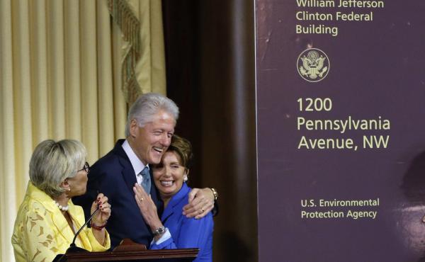 Former President Bill Clinton hugs House Minority Leader Nancy Pelosi of California as another Democrat, Sen. Barbara Boxer of California, looks on at Wednesday's ceremony naming the Environmental Protection Agency headquarters for him. Former President Bill Clinton hugs House Minority Leader Nancy Pelosi of California as another Democrat, Sen. Barbara Boxer of California, looks on at Wednesday's ceremony naming the Environmental Protection Agency headquarters for him.