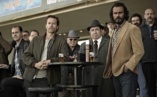 Guy Pearce (front left) plays Jack Irish in TV movie adaptations of two Peter Temple novels. The films, Bad Debts and Black Tide, are broadcast by digital provider Acorn TV. Guy Pearce (front left) plays Jack Irish in TV movie adaptations of two Peter Temple novels. The films, Bad Debts and Black Tide, are broadcast by digital provider Acorn TV.