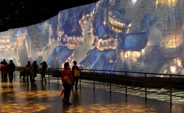 One of the highlights of the new China Art Palace in Shanghai is a giant digital rendering of a famous ancient scroll, "Along the River During Qingming Festival," which includes figures that walk and talk. The work was first presented at the 2010 World Ex One of the highlights of the new China Art Palace in Shanghai is a giant digital rendering of a famous ancient scroll, "Along the River During Qingming Festival," which includes figures that walk and talk. The work was first presented at the 2010 World Ex