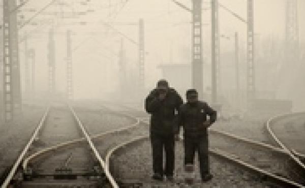 Men walk along a railway line in Beijing on Jan. 12, as air pollution reached hazardous levels. Men walk along a railway line in Beijing on Jan. 12, as air pollution reached hazardous levels.