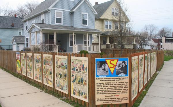 Panels from Action Comics No. 1, the first Superman comic, adorn the site of illustrator Joe Shuster's former apartment building, long since demolished. Panels from Action Comics No. 1, the first Superman comic, adorn the site of illustrator Joe Shuster's former apartment building, long since demolished.