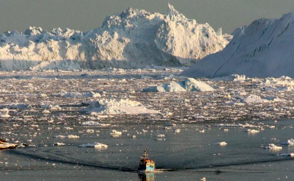 A boat skims through the melting ice in the Ilulissat fjord in August 2008, on the western coast of Greenland. A boat skims through the melting ice in the Ilulissat fjord in August 2008, on the western coast of Greenland.