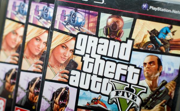 A close view of the packaging of Grand Theft Auto V at the midnight opening at the HMV music store in London on Tuesday. It made history with a record $800 million in sales on its first day. This version continues to generate controversy over its glorific A close view of the packaging of Grand Theft Auto V at the midnight opening at the HMV music store in London on Tuesday. It made history with a record $800 million in sales on its first day. This version continues to generate controversy over its glorific