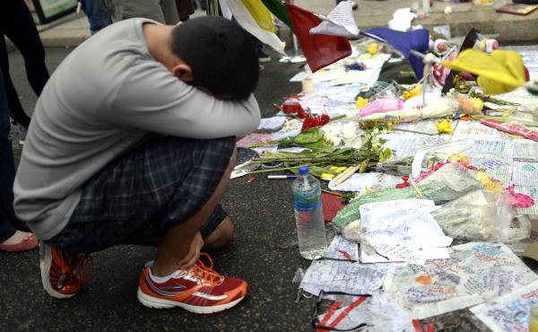 Visitors paid their respects at a makeshift memorial on Boylston Street on April 20, near the scene of the Boston Marathon bombings. Visitors paid their respects at a makeshift memorial on Boylston Street on April 20, near the scene of the Boston Marathon bombings.