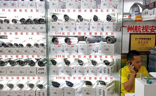 A man sells surveillance cameras at the main electronics market in Tienhe district, Guangzhou, in southern China's Guangdong province, on Aug. 8. A man sells surveillance cameras at the main electronics market in Tienhe district, Guangzhou, in southern China's Guangdong province, on Aug. 8.