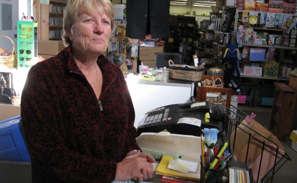 Lela Petersen, owner of the Anything And Everything store in Flagler, Colo., expects the cost of health insurance for her and her husband to drop by my more than half next year. Lela Petersen, owner of the Anything And Everything store in Flagler, Colo., expects the cost of health insurance for her and her husband to drop by my more than half next year.
