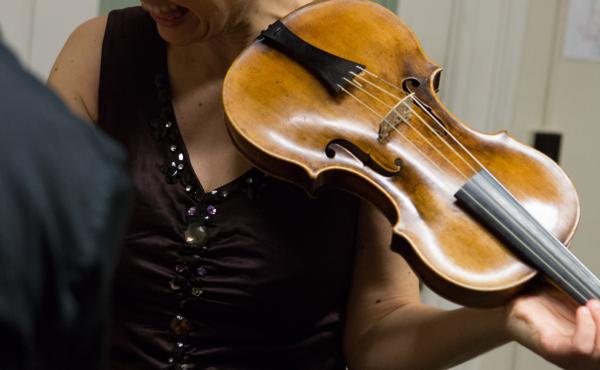 Violinist Amandine Beyer holds Mozart's own violin backstage at Boston's Jordan Hall on Monday. Violinist Amandine Beyer holds Mozart's own violin backstage at Boston's Jordan Hall on Monday.
