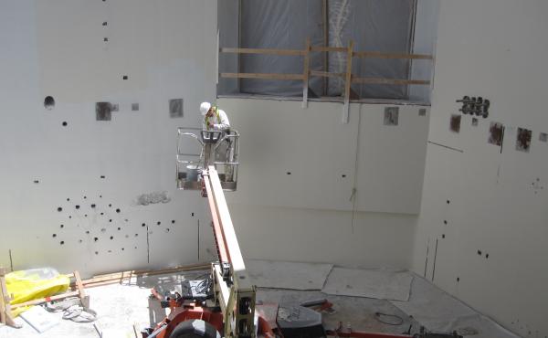 A construction worker paints walls at the Maryland Proton Treatment Center in Baltimore. Each of the center's five rooms will contain a massive piece of equipment that will rotate around a cancer patient to deliver a special kind of radiation. A construction worker paints walls at the Maryland Proton Treatment Center in Baltimore. Each of the center's five rooms will contain a massive piece of equipment that will rotate around a cancer patient to deliver a special kind of radiation.