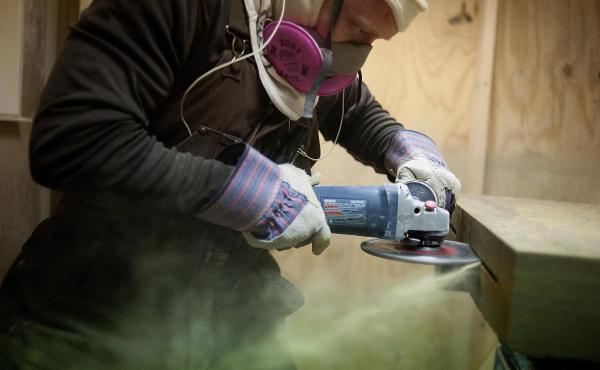 A worker makes a cut in the side of a sandstone block at the Cleveland Quarries facility in Vermilion, Ohio, earlier this month. The legal limit on the amount of silica that workers can inhale was set decades ago. A worker makes a cut in the side of a sandstone block at the Cleveland Quarries facility in Vermilion, Ohio, earlier this month. The legal limit on the amount of silica that workers can inhale was set decades ago.