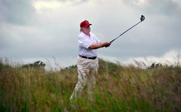 Donald Trump plays a stroke as he officially opens his new Trump International Golf Links course in Aberdeenshire, Scotland, last July. Now, he is aggressively fighting Scottish plans to build 11 wind turbines off the coast overlooked by his golf course a Donald Trump plays a stroke as he officially opens his new Trump International Golf Links course in Aberdeenshire, Scotland, last July. Now, he is aggressively fighting Scottish plans to build 11 wind turbines off the coast overlooked by his golf course a