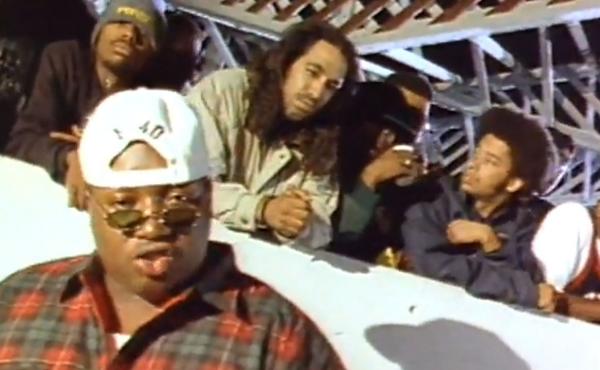 A still from the video for E-40's 1993 song "Practice Looking Hard," in which rappers like The Coup's Boots Riley (second from right) and Tupac (not pictured) also appeared. A still from the video for E-40's 1993 song "Practice Looking Hard," in which rappers like The Coup's Boots Riley (second from right) and Tupac (not pictured) also appeared.