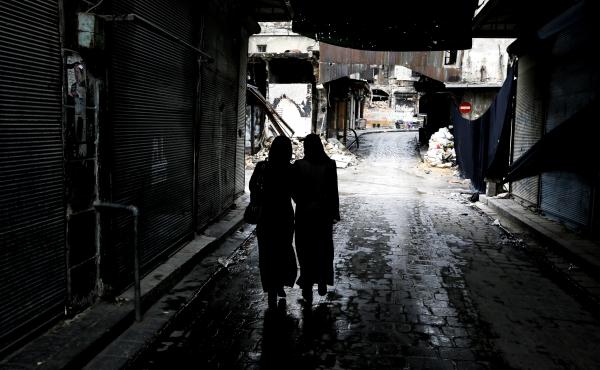 Syrian women walk through a market area in the northern city of Aleppo last November. A new website is documenting the use of rape in the Syrian conflict. Syrian women walk through a market area in the northern city of Aleppo last November. A new website is documenting the use of rape in the Syrian conflict.