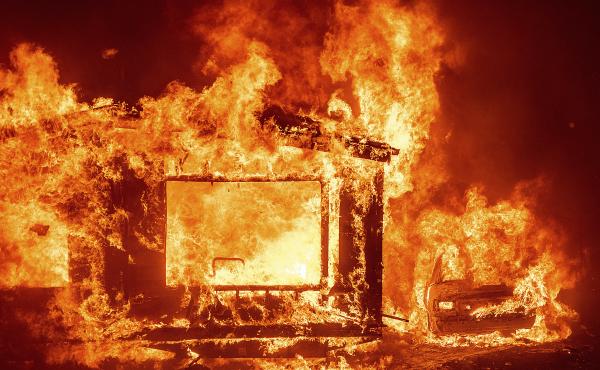 A mobile home and car burn at Spanish Flat Mobile Villa as the LNU Lightning Complex fires tear through unincorporated Napa County, Calif., on Tuesday. A mobile home and car burn at Spanish Flat Mobile Villa as the LNU Lightning Complex fires tear through unincorporated Napa County, Calif., on Tuesday.