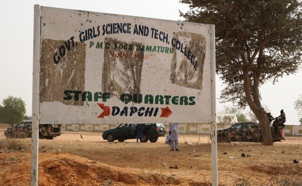 Soldiers drive past a sign leading to the Government Girls Science and Technical College staff quarters in Dapchi, Nigeria, on Thursday. Scores of schoolgirls have been reported missing in Monday's suspected Boko Haram attack. Soldiers drive past a sign leading to the Government Girls Science and Technical College staff quarters in Dapchi, Nigeria, on Thursday. Scores of schoolgirls have been reported missing in Monday's suspected Boko Haram attack.