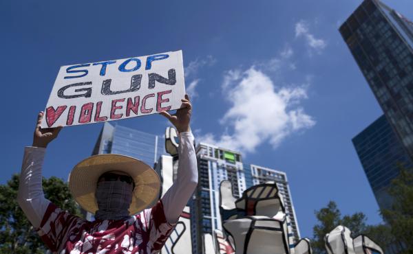 Gun control advocates hold signs during a protest at Discovery Green across from the National Rifle Association Annual Meeting at the George R. Brown Convention Center on Friday in Houston, Texas. Gun control advocates hold signs during a protest at Discovery Green across from the National Rifle Association Annual Meeting at the George R. Brown Convention Center on Friday in Houston, Texas.