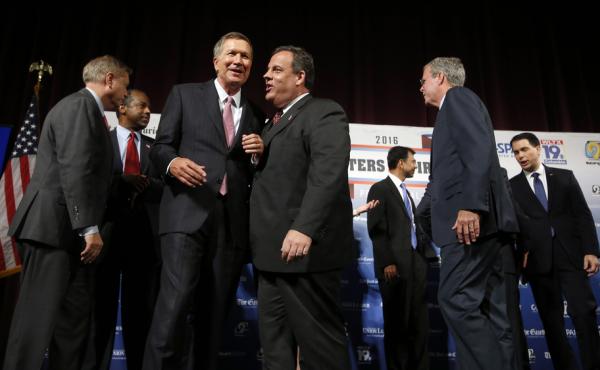 Republican presidential candidates, from left, Lindsey Graham, Ben Carson, John Kasich, Chris Christie, Bobby Jindal, Jeb Bush, Scott Walker and Rick Santorum speak among themselves after a forum Monday, Aug. 3, 2015, in Manchester, N.H. Republican presidential candidates, from left, Lindsey Graham, Ben Carson, John Kasich, Chris Christie, Bobby Jindal, Jeb Bush, Scott Walker and Rick Santorum speak among themselves after a forum Monday, Aug. 3, 2015, in Manchester, N.H.