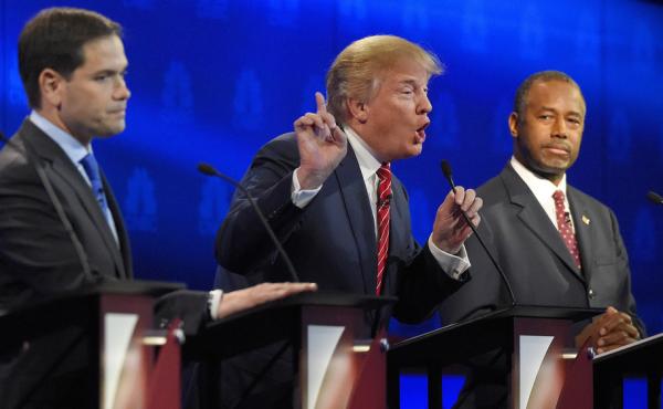 Donald Trump, center, makes a point as Marco Rubio, left, and Ben Carson look on during the CNBC Republican presidential debate at the University of Colorado, Boulder. Donald Trump, center, makes a point as Marco Rubio, left, and Ben Carson look on during the CNBC Republican presidential debate at the University of Colorado, Boulder.