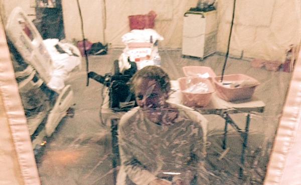 A photo taken Sunday of Kaci Hickox in an isolation tent at University Hospital in Newark, N.J. Hickox, who was later discharged and allowed to return to her home in Maine, says she has no intention of abiding by a "voluntary" quarantine there. A photo taken Sunday of Kaci Hickox in an isolation tent at University Hospital in Newark, N.J. Hickox, who was later discharged and allowed to return to her home in Maine, says she has no intention of abiding by a "voluntary" quarantine there.