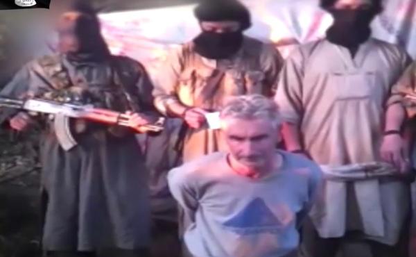 This still image from video published on the Internet on Wednesday by a group calling itself Jund al-Khilafah, or Soldiers of the Caliphate, shows members of the group standing behind French mountaineer Herve Gourdel just before beheading him. This still image from video published on the Internet on Wednesday by a group calling itself Jund al-Khilafah, or Soldiers of the Caliphate, shows members of the group standing behind French mountaineer Herve Gourdel just before beheading him.