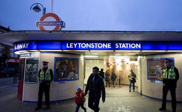 British police officers stand outside Leytonstone underground train station in east London on Monday. Police are stepping up patrols at transport hubs after Saturday's stabbing attacks, which injured three. British police officers stand outside Leytonstone underground train station in east London on Monday. Police are stepping up patrols at transport hubs after Saturday's stabbing attacks, which injured three.