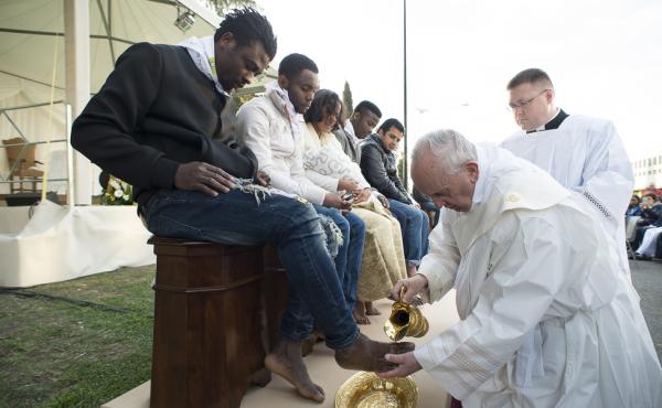 Pope Francis washes the foot of a refugee during a ritual at the Castelnuovo di Porto refugees center outside Rome on Thursday. Pope Francis washes the foot of a refugee during a ritual at the Castelnuovo di Porto refugees center outside Rome on Thursday.
