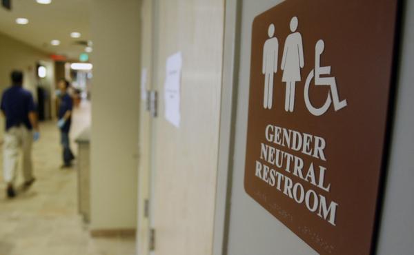 A sign marks the entrance to a gender-neutral restroom at the University of Vermont in Burlington, Vt. A sign marks the entrance to a gender-neutral restroom at the University of Vermont in Burlington, Vt.