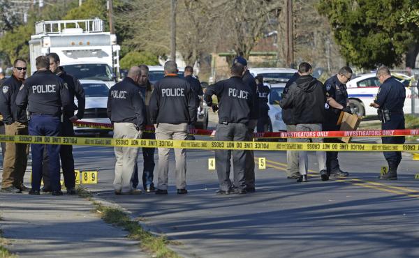 Officers investigate the scene of a shooting in Baton Rouge, La., in February. Officers investigate the scene of a shooting in Baton Rouge, La., in February.