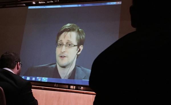 Former National Security Agency contractor Edward Snowden speaks via video conference at Johns Hopkins University in February. Former National Security Agency contractor Edward Snowden speaks via video conference at Johns Hopkins University in February.