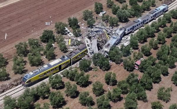 This aerial handout photo shows what is left of two commuter trains after their head-on collision in southern Italy on Tuesday. This aerial handout photo shows what is left of two commuter trains after their head-on collision in southern Italy on Tuesday.