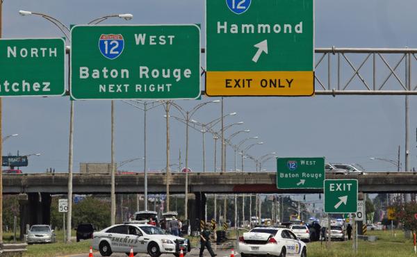 Baton Rouge police block Airline Highway after police were shot in Baton Rouge, La., Sunday, July 17, 2016. Authorities in Louisiana say several law enforcement officers are dead, and several injured in Baton Rouge after on-duty law enforcement officers w Baton Rouge police block Airline Highway after police were shot in Baton Rouge, La., Sunday, July 17, 2016. Authorities in Louisiana say several law enforcement officers are dead, and several injured in Baton Rouge after on-duty law enforcement officers w