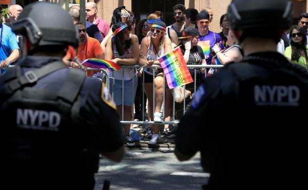 Heavily armed police officers watch over the crowds at the NYC Pride Parade in New York on June 26. Heavily armed police officers watch over the crowds at the NYC Pride Parade in New York on June 26.