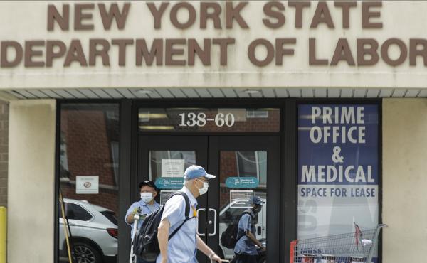 Pedestrians pass a New York State Department of Labor office June 11 in Queens. The Federal Reserve expects the U.S. unemployment rate to still be more than 9% by the end of 2020. Pedestrians pass a New York State Department of Labor office June 11 in Queens. The Federal Reserve expects the U.S. unemployment rate to still be more than 9% by the end of 2020.