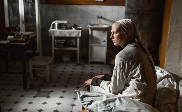 Iya (Viktoria Miroshnichenko) looks on in the grim but ultimately warm-hearted Beanpole. Iya (Viktoria Miroshnichenko) looks on in the grim but ultimately warm-hearted Beanpole.