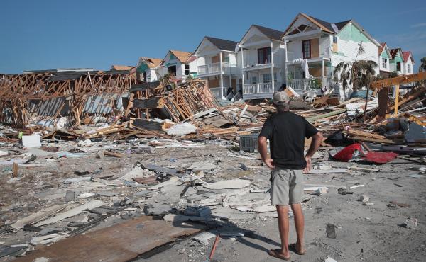 A resident of Mexico Beach, Fla., looks over damage caused to the Florida Panhandle by Hurricane Michael in October 2018. A resident of Mexico Beach, Fla., looks over damage caused to the Florida Panhandle by Hurricane Michael in October 2018.
