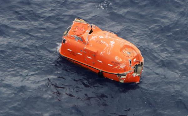 An unoccupied lifeboat drifts near Kodakarajima island. Japanese authorities are racing to find dozens of missing sailors from a cargo ship that sank in a typhoon. An unoccupied lifeboat drifts near Kodakarajima island. Japanese authorities are racing to find dozens of missing sailors from a cargo ship that sank in a typhoon.