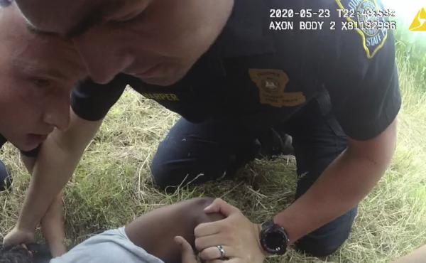 In this May 23, 2020 image from Louisiana State Police body camera video, Troopers Jacob Brown (left), George Harper (center) and others restrain motorist Antonio Harris after a high-speed chase in Franklin Parish, La. In this May 23, 2020 image from Louisiana State Police body camera video, Troopers Jacob Brown (left), George Harper (center) and others restrain motorist Antonio Harris after a high-speed chase in Franklin Parish, La.