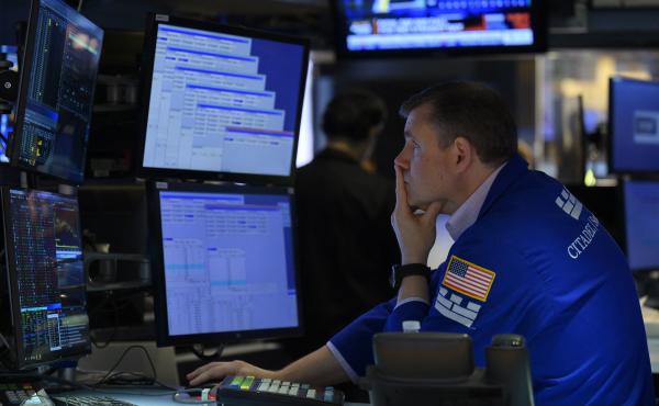 A trader works on the floor of the New York Stock Exchange in New York City on Aug. 5. The majority of America's top companies have reported strong earnings, but warning signs about the economy are also emerging from their corporate earnings. A trader works on the floor of the New York Stock Exchange in New York City on Aug. 5. The majority of America's top companies have reported strong earnings, but warning signs about the economy are also emerging from their corporate earnings.